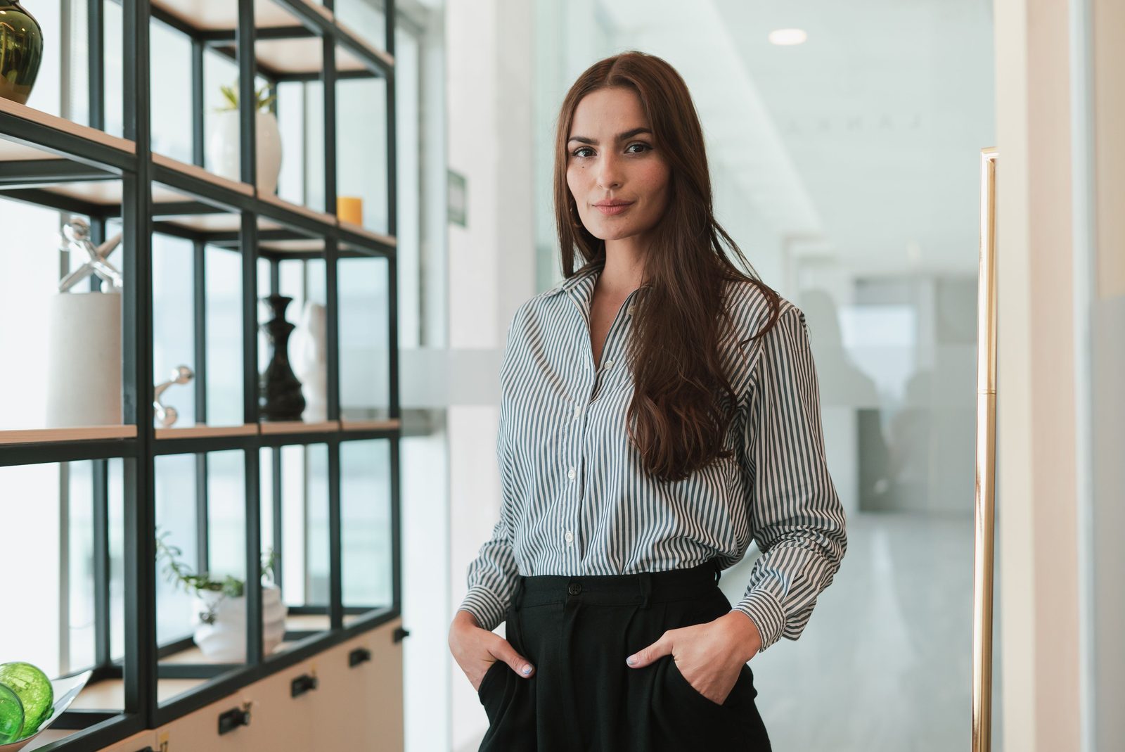 Professional portrait of a woman in a modern workplace