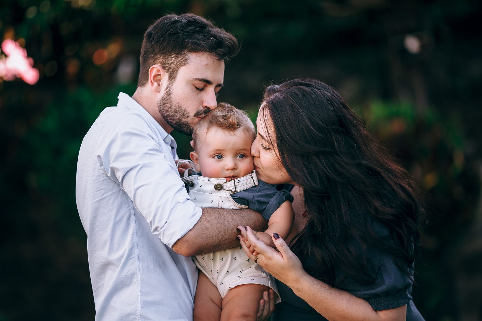 Parents holding their baby during an outdoor family portrait
